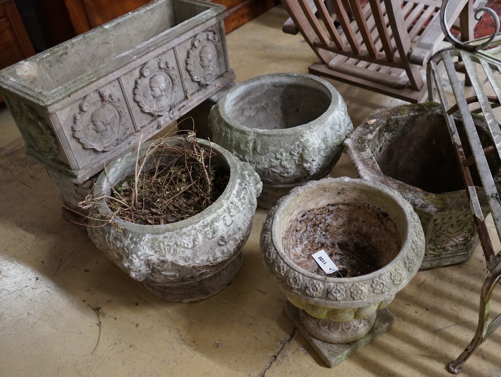 A rectangular reconstituted stone garden planter on twin block supports, width 70cm, a hexagonal garden planter and three circular garden planters